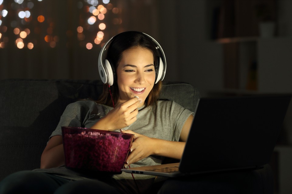 lady watching streaming content on laptop