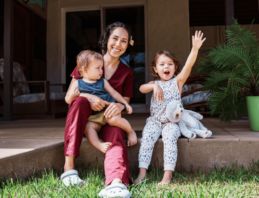 nurse playing with children outside
