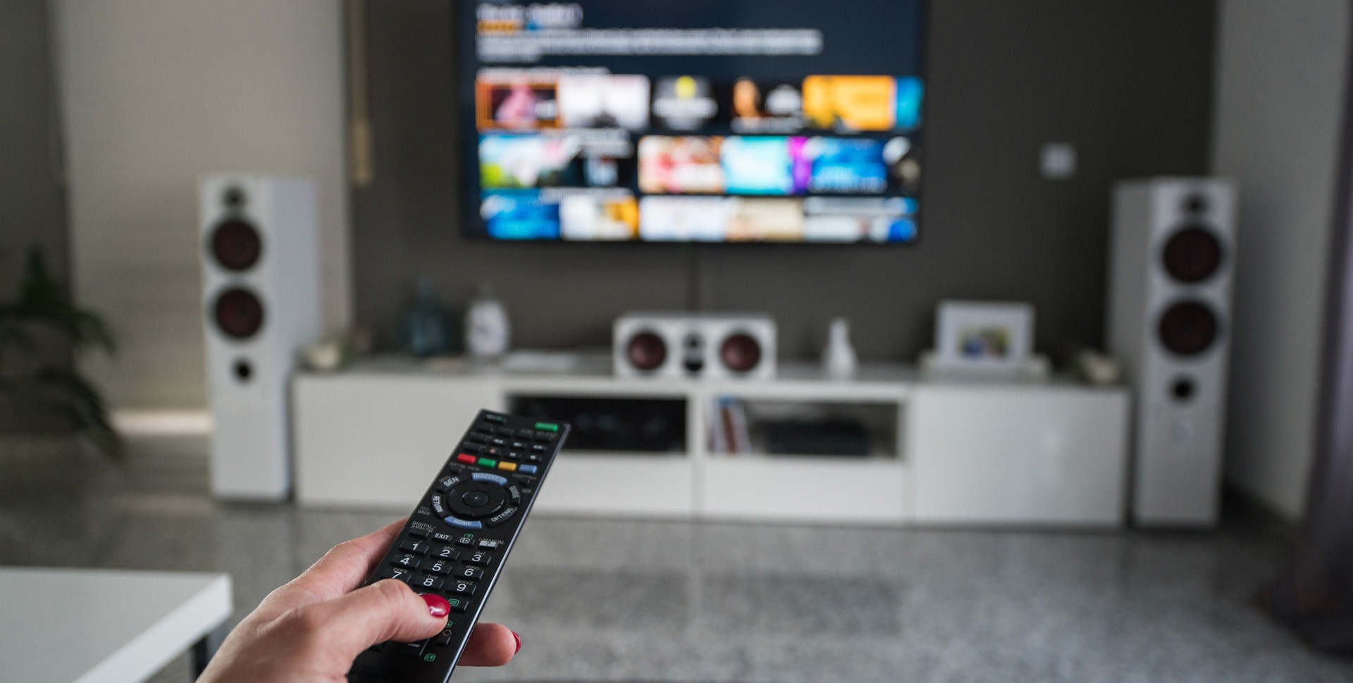 remote control in foreground with streaming tv service in background