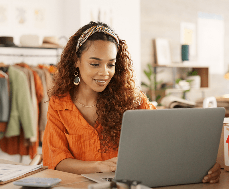 female business owner working on computer